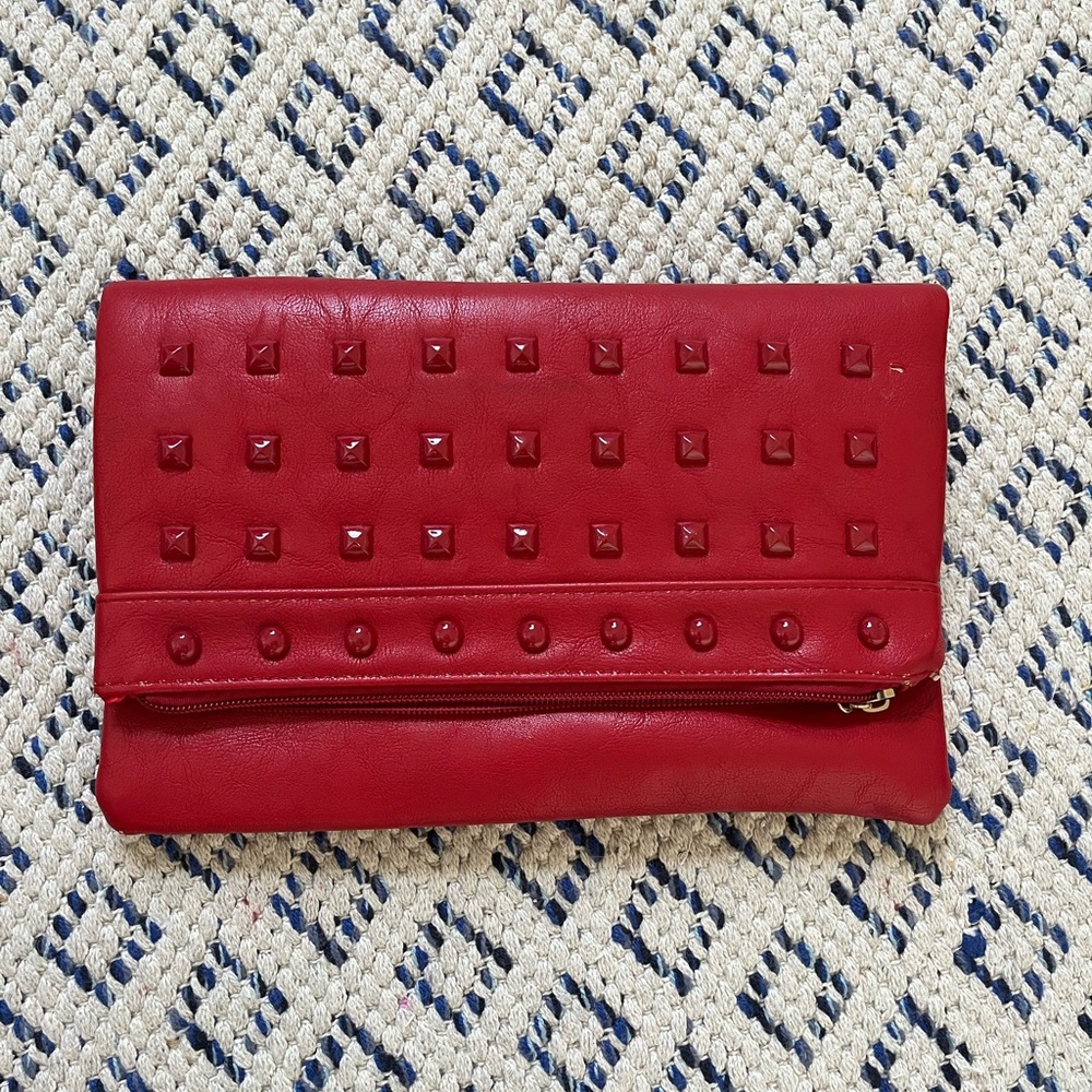 Red studded clutch.